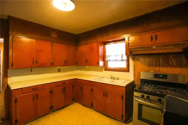 a kitchen with a stove and a sink
