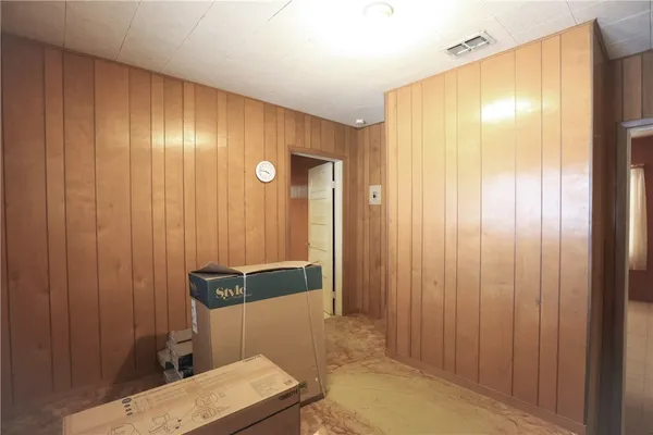 a bathroom with a shower and a sink