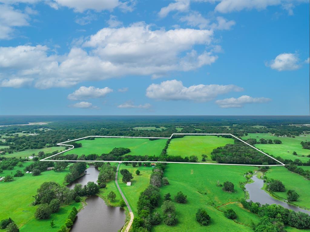 3 County Road 1726 Yantis, TX 75497 - Photo 10 of 11 an aerial view of a golf course with a garden