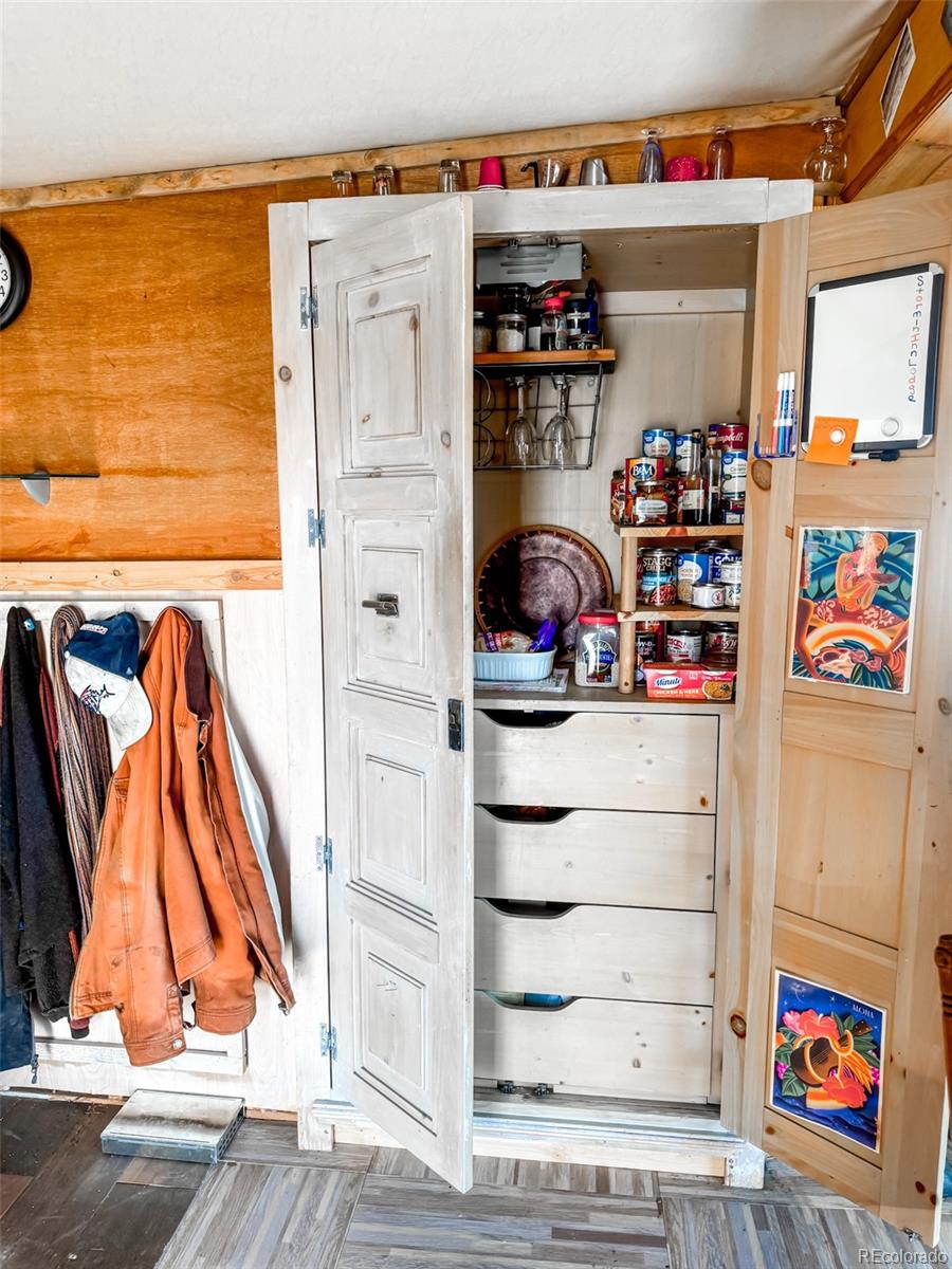 1725 35 1/10 Road De Beque, CO 81630 - Photo 18 of 36 a view of walk in closet with clothes and shoes