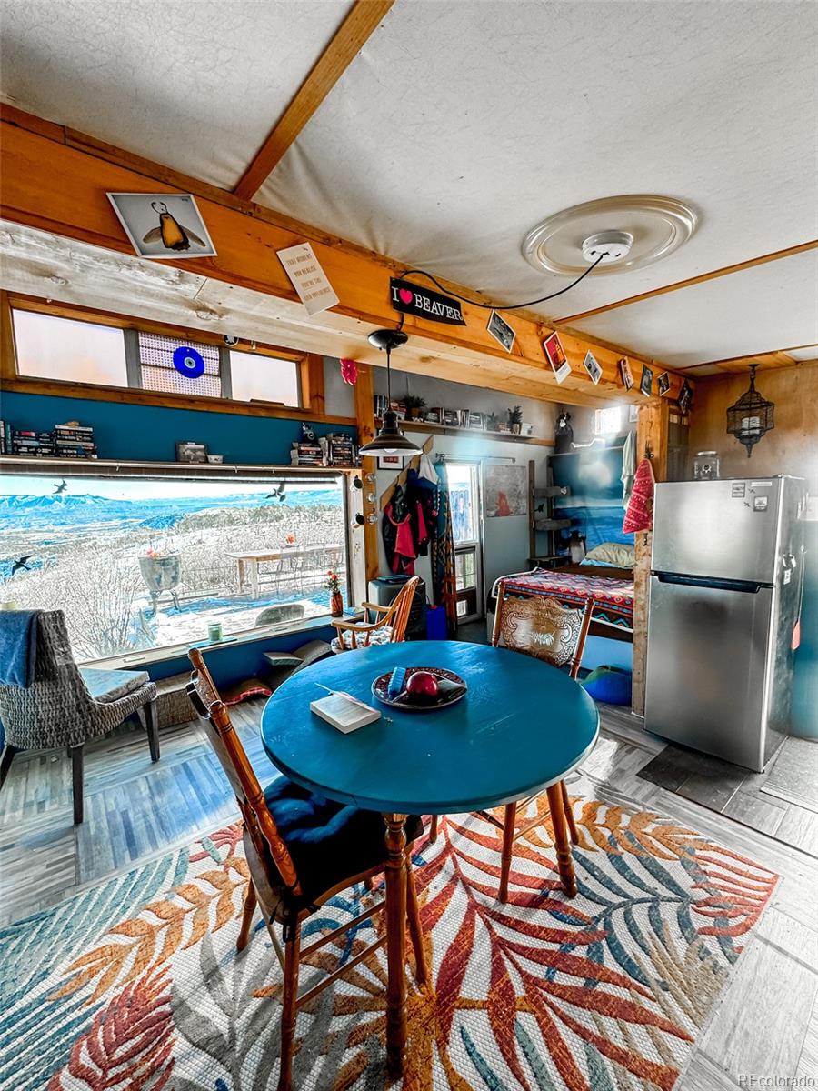 1725 35 1/10 Road De Beque, CO 81630 - Photo 22 of 36 a living room with a table and chairs