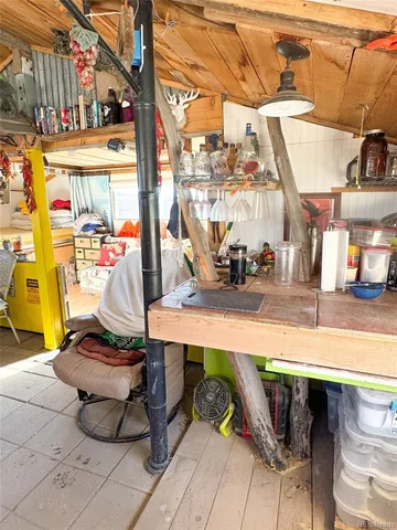 a view of a chairs and table in a patio