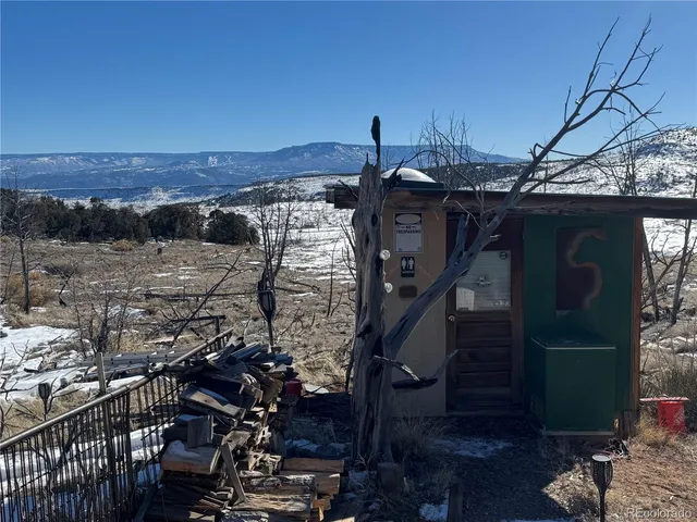 a view of a backyard of the house