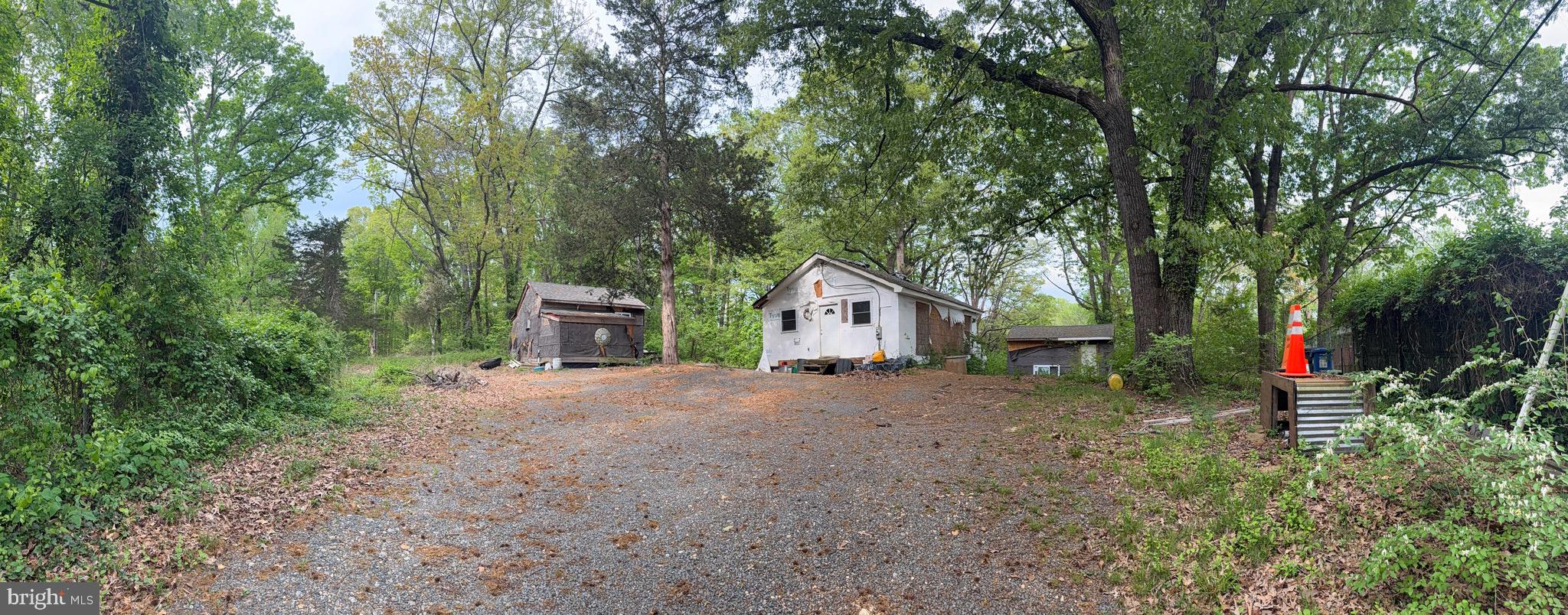 4109 Meyers Road Triangle, VA 22172 - Photo 2 of 10 a view of a house with large trees and plants