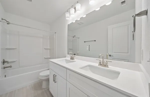 an empty room with closet and a ceiling fan