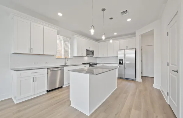 a picture of a bathroom with a sink and a mirror