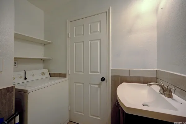 a bathroom with a sink a toilet and vanity