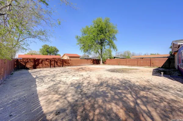 a view of a backyard of the house