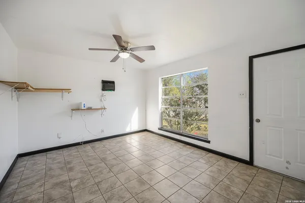 a view of an empty room with a window
