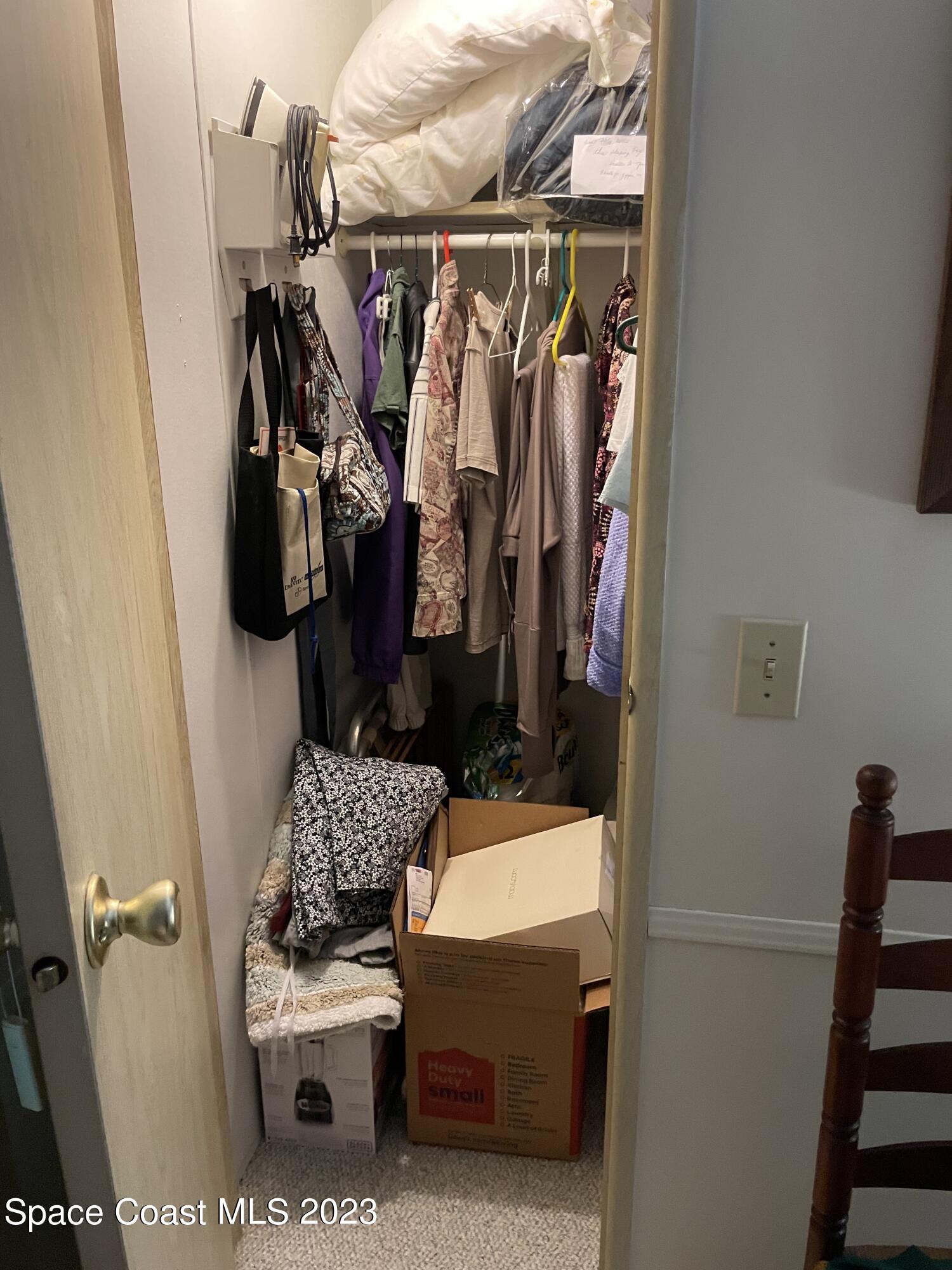 906 Oleander Circle Sebastian, FL 32976 - Photo 13 of 24 a bathroom with a toilet and a shower curtain