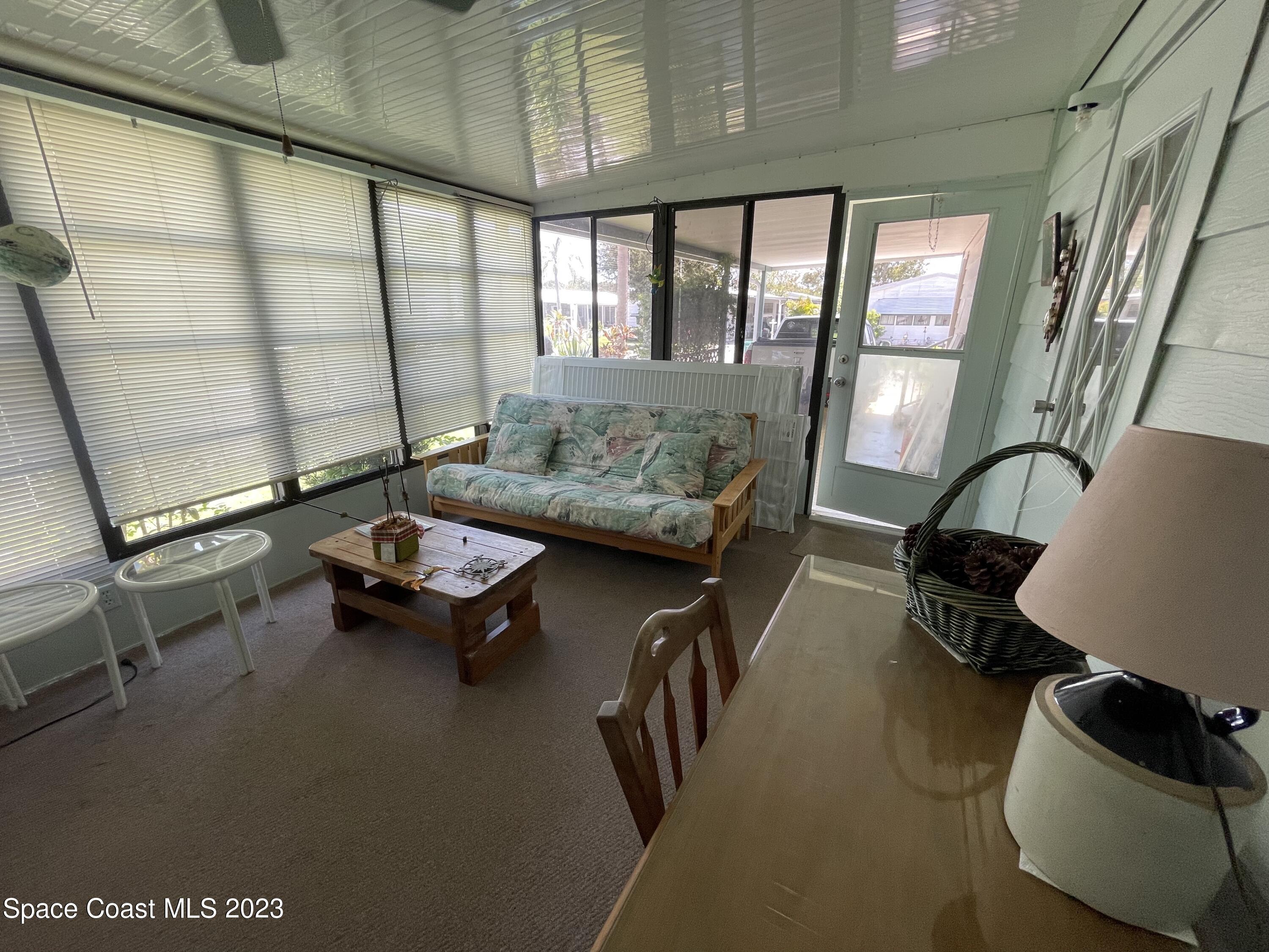 906 Oleander Circle Sebastian, FL 32976 - Photo 24 of 24 a living room with furniture and a window