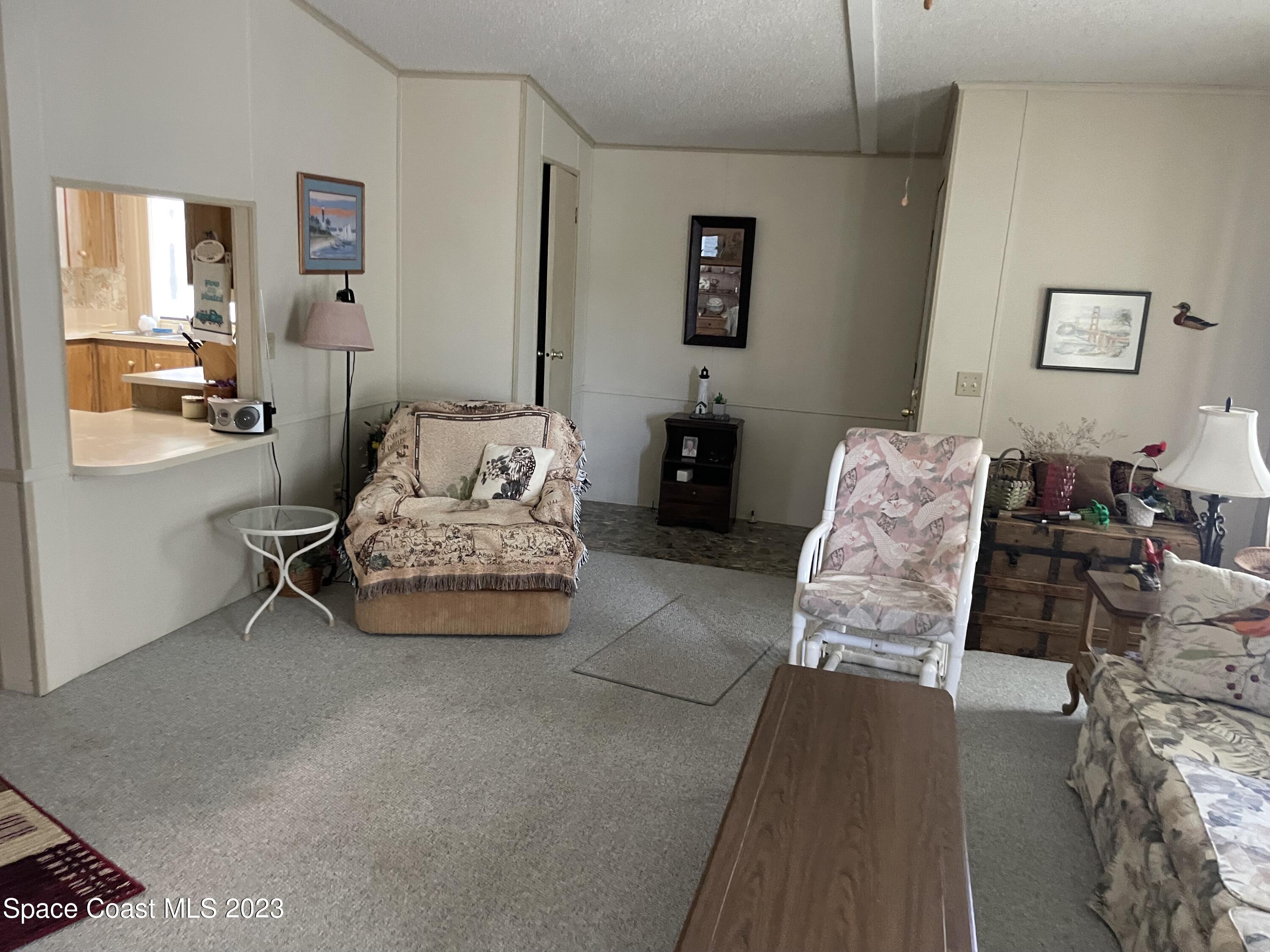906 Oleander Circle Sebastian, FL 32976 - Photo 6 of 24 a living room with furniture and a couch