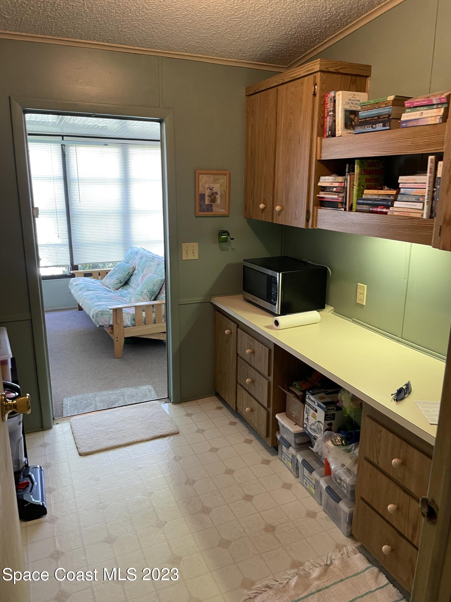 906 Oleander Circle Sebastian, FL 32976 - Photo 10 of 24 a en suite bathroom with a tub double vanity and window