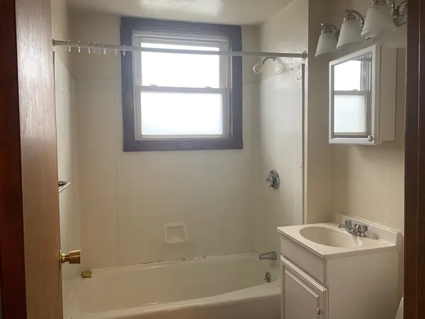 a bathroom with a sink toilet and tub