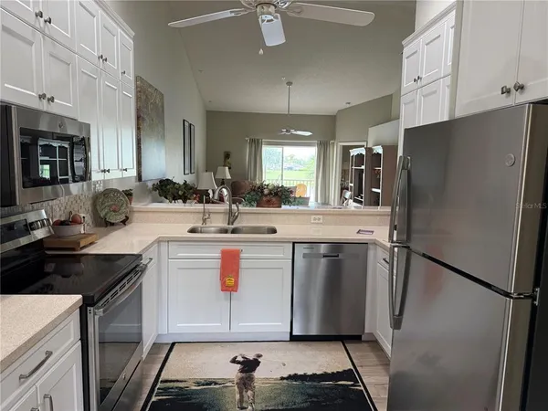 a white refrigerator freezer sitting inside of a kitchen