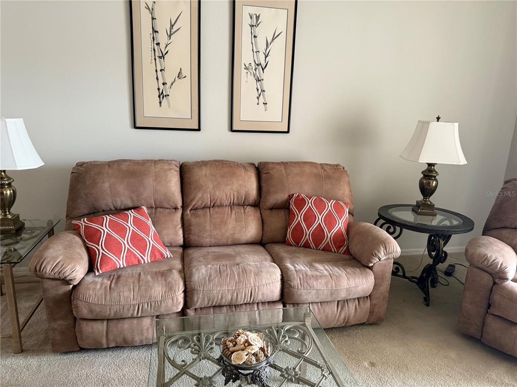5251 Mahogany Run Avenue, Unit 524 Sarasota, FL 34241 - Photo 18 of 40 a living room with furniture and a couch