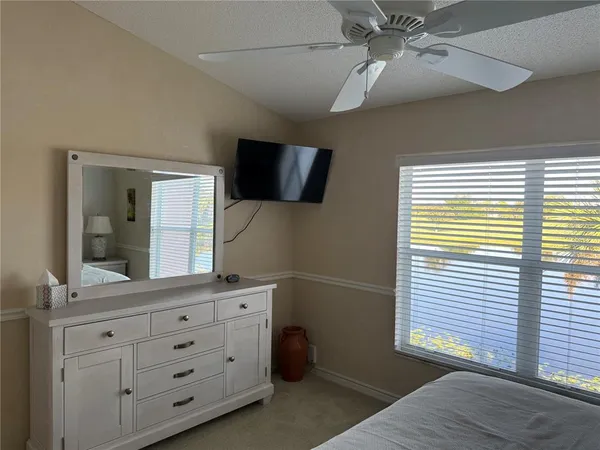 a bathroom with a sink and mirror with toilet