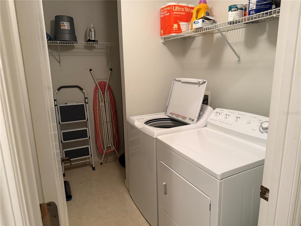 5251 Mahogany Run Avenue, Unit 524 Sarasota, FL 34241 - Photo 31 of 40 a utility room with dryer and washer