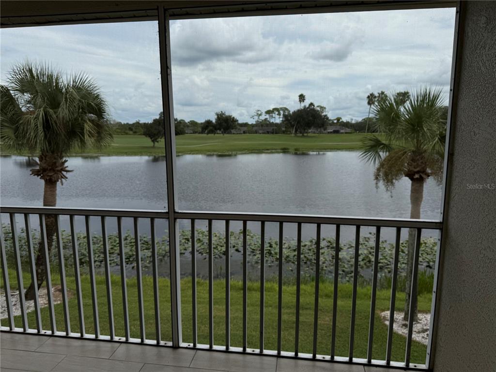 5251 Mahogany Run Avenue, Unit 524 Sarasota, FL 34241 - Photo 32 of 40 a view of a lake from a balcony