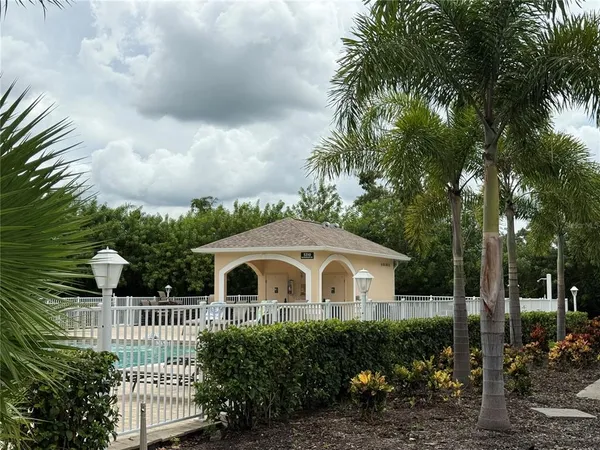 a view of swimming pool with a bench