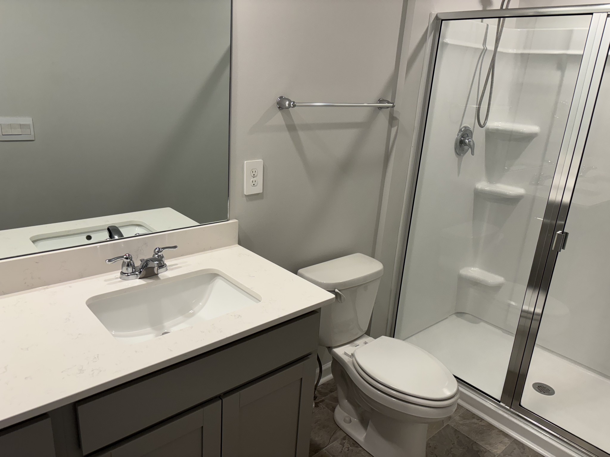 266 Redhead Lane Lebanon, TN 37090 - Photo 17 of 18 a bathroom with a sink a toilet a mirror and shower
