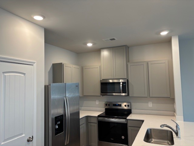 266 Redhead Lane Lebanon, TN 37090 - Photo 6 of 18 a kitchen with a refrigerator a stove and a microwave