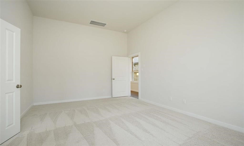 21582 Jordan Pond Ridge Porter, TX 77365 - Photo 12 of 21 a view of an empty room