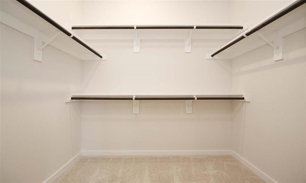 21582 Jordan Pond Ridge Porter, TX 77365 - Photo 17 of 21 a view of a room with racks on the wall