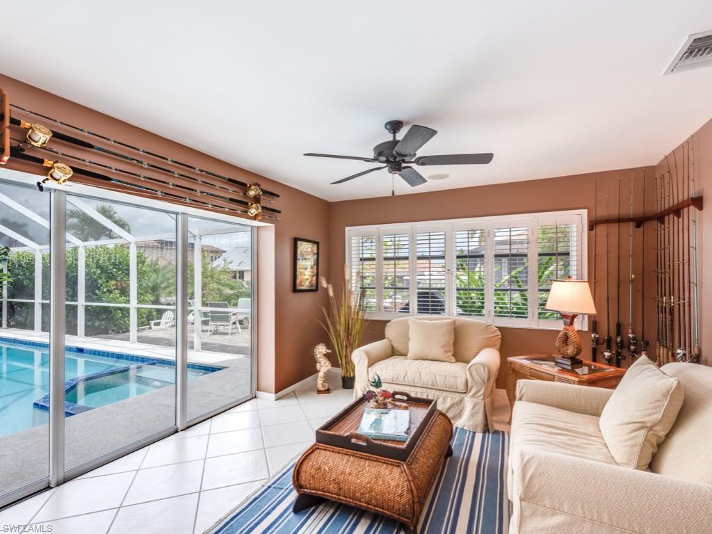 1820 Kingfish Road Naples, FL 34102 - Photo 8 of 20 a living room with furniture and a window