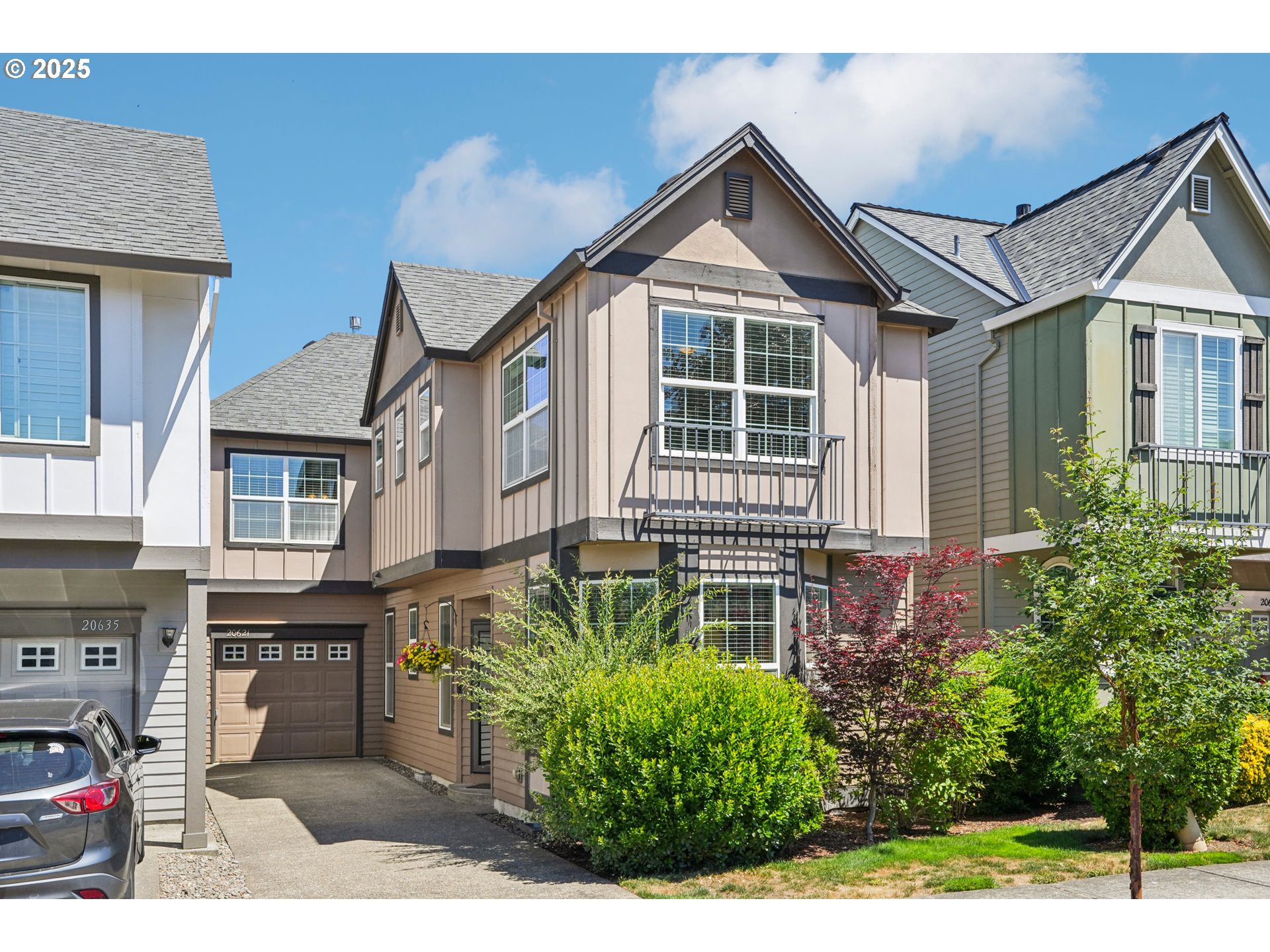 20621 Southwest Rosemount Street Beaverton, OR 97078 - Photo 1 of 37 a front view of a house with a yard
