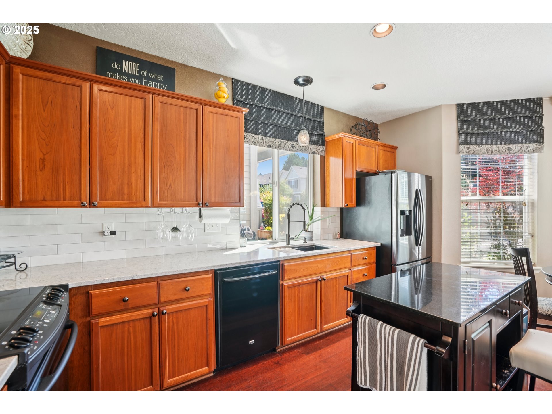 20621 Southwest Rosemount Street Beaverton, OR 97078 - Photo 11 of 37 a kitchen with stainless steel appliances a sink stove and refrigerator