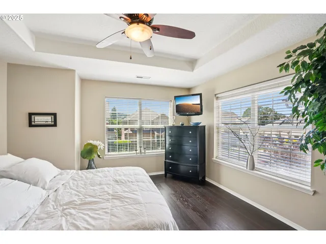a bedroom with a bed dresser and a window
