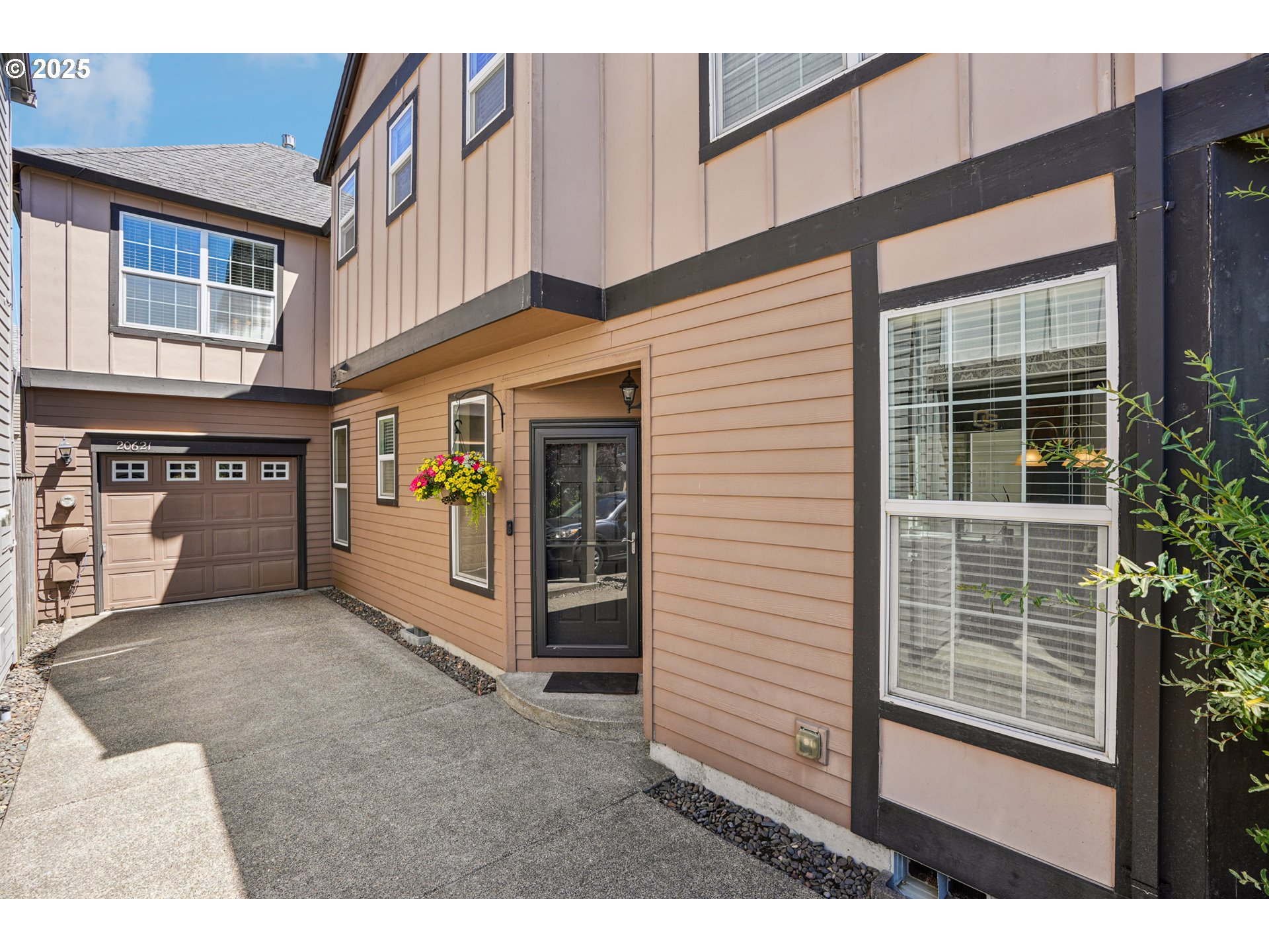 20621 Southwest Rosemount Street Beaverton, OR 97078 - Photo 2 of 37 a view of white house with large windows