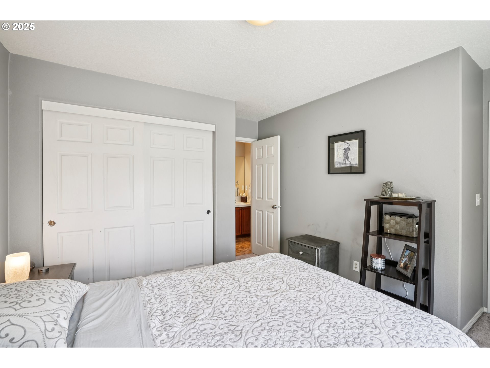 20621 Southwest Rosemount Street Beaverton, OR 97078 - Photo 28 of 37 a bedroom with a bed and a dresser