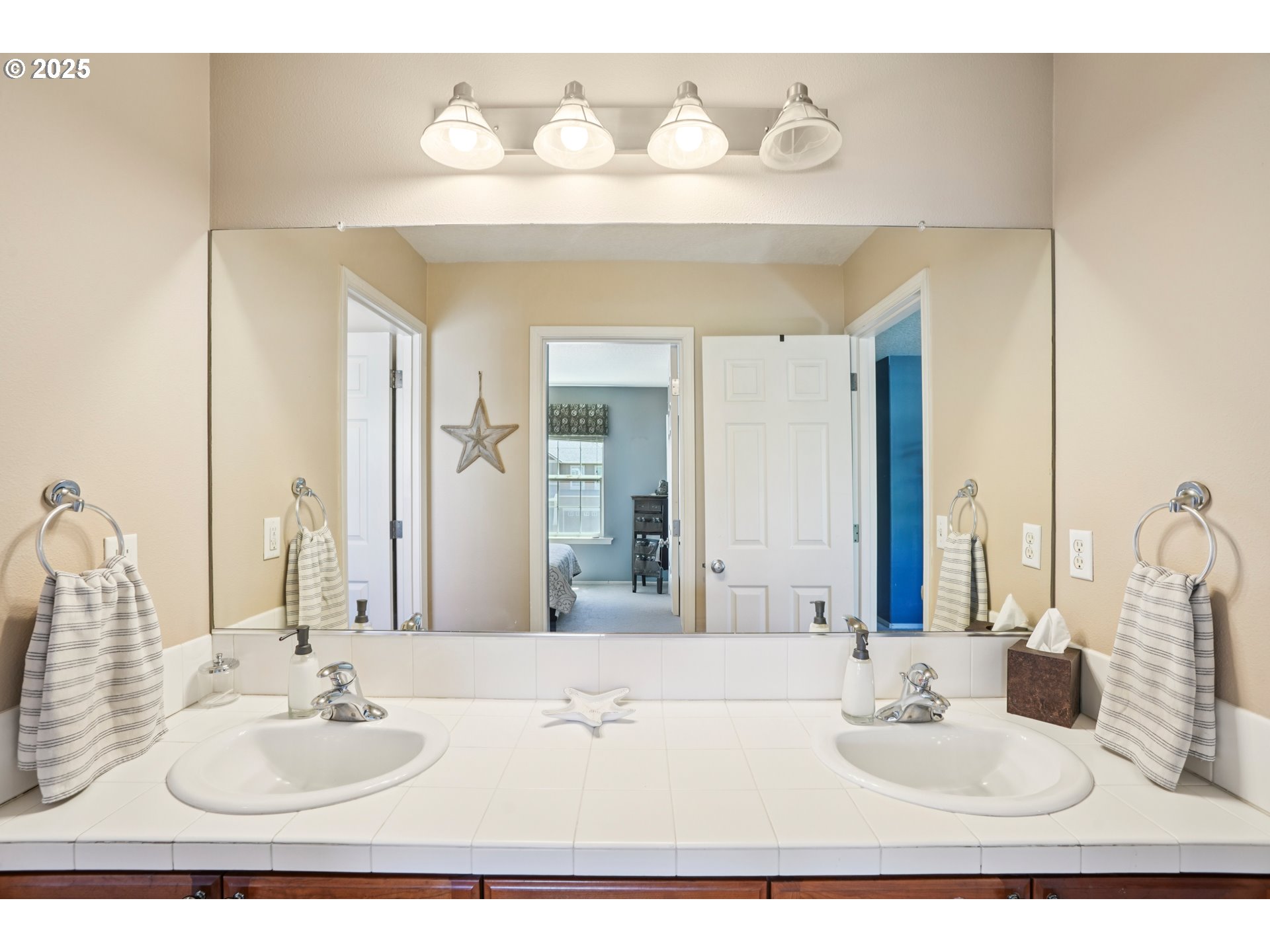 20621 Southwest Rosemount Street Beaverton, OR 97078 - Photo 30 of 37 a bathroom with a sink and a mirror