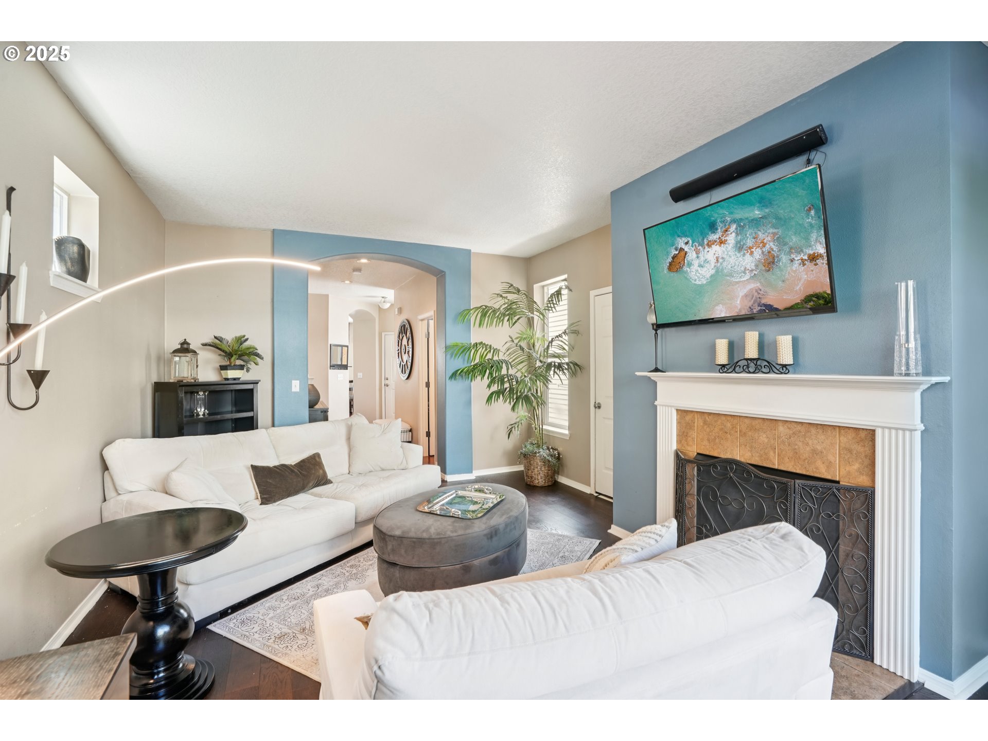 20621 Southwest Rosemount Street Beaverton, OR 97078 - Photo 6 of 37 a living room with furniture and a fireplace