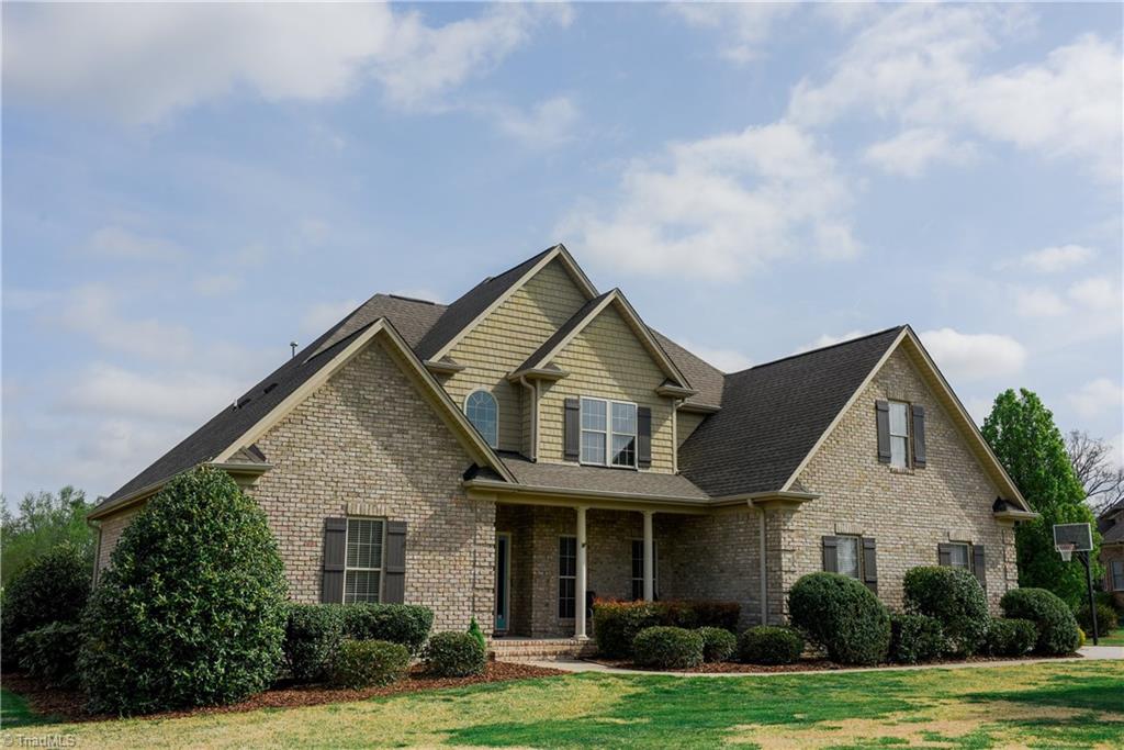1743 Diercrest Street Oak Ridge, NC 27310 - Photo 1 of 30 Stately brick transitional with front porch.