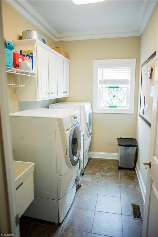 1743 Diercrest Street Oak Ridge, NC 27310 - Photo 13 of 30 Downstairs laundry room with tub.