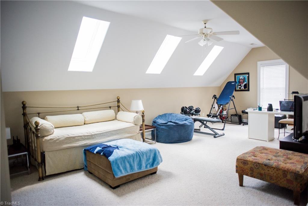 1743 Diercrest Street Oak Ridge, NC 27310 - Photo 26 of 30 Light & bright bonus room features 3 skylights & ceiling fan.