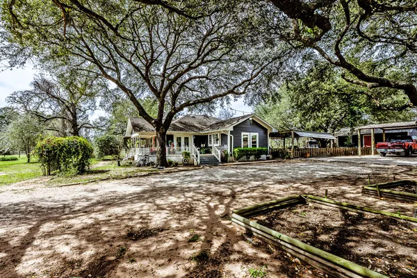 a front view of a house with yard porch and livingroom