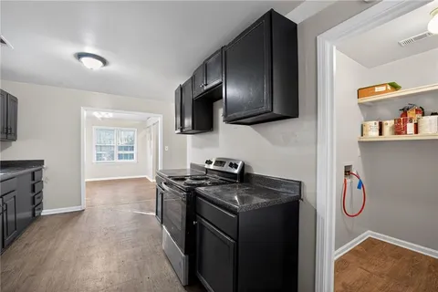 a kitchen with a appliances and a sink