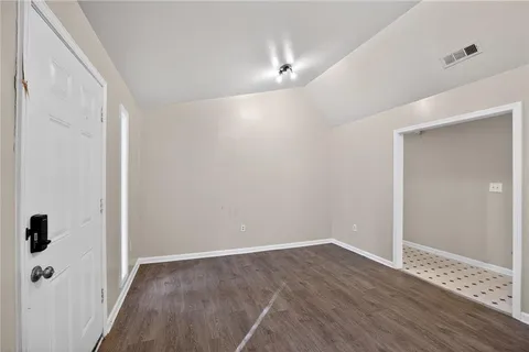a view of a bathroom with wooden floor