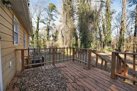 a view of a balcony with wooden floor