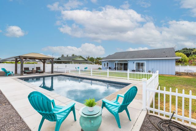 a view of a balcony with wooden floor