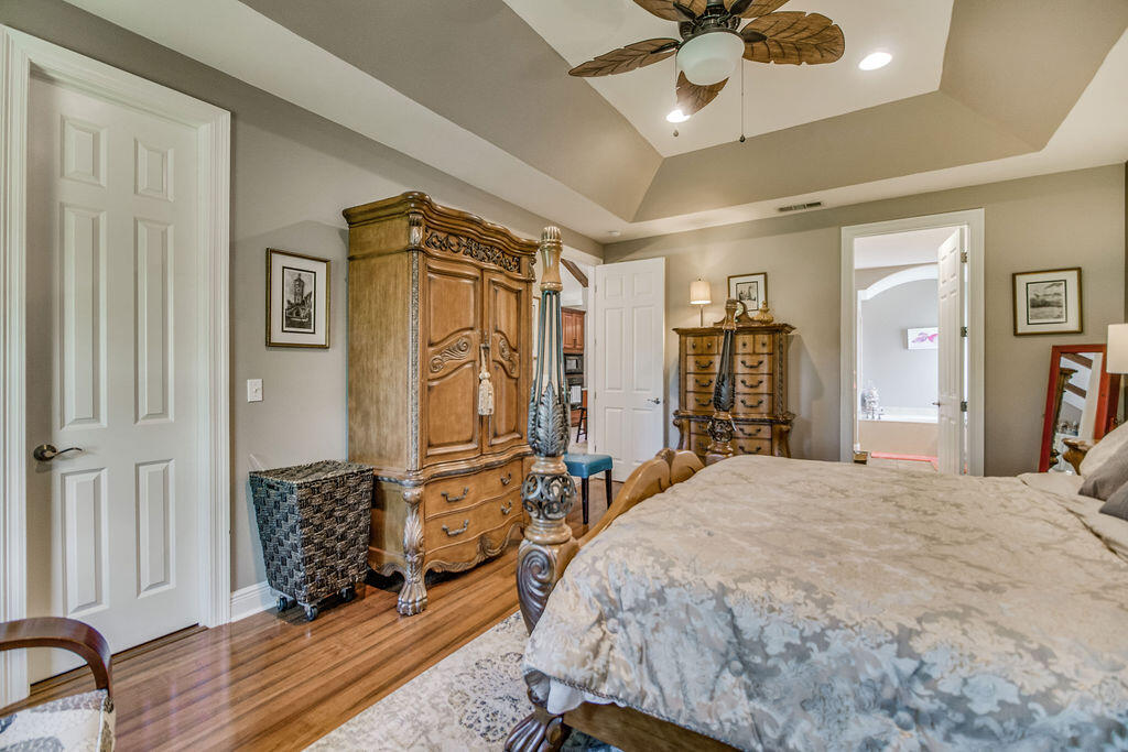 2655 Masters Boulevard Navarre, FL 32566 - Photo 21 of 87 a bedroom with a bed dresser and a window