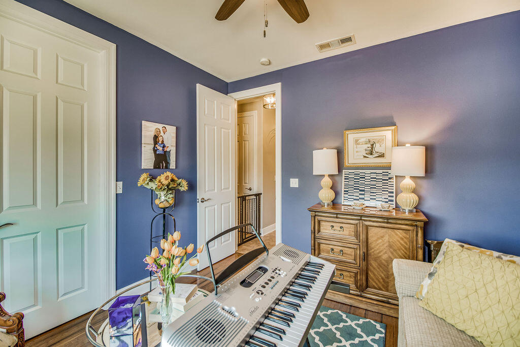 2655 Masters Boulevard Navarre, FL 32566 - Photo 32 of 87 a living room with furniture and wooden floor