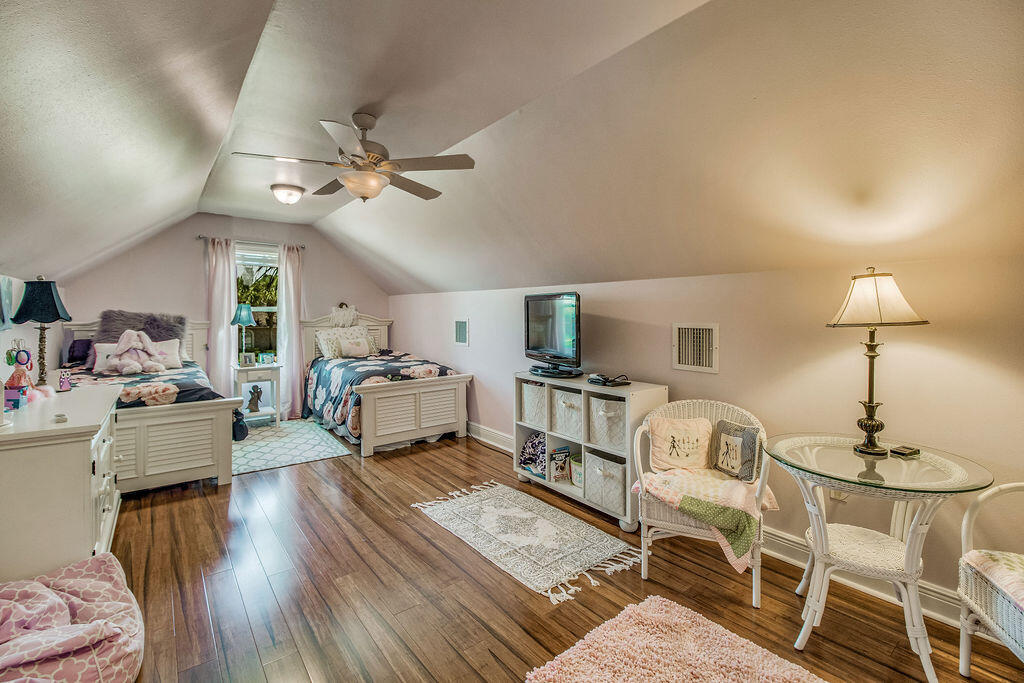 2655 Masters Boulevard Navarre, FL 32566 - Photo 45 of 87 a living room with furniture a flat screen tv and a table