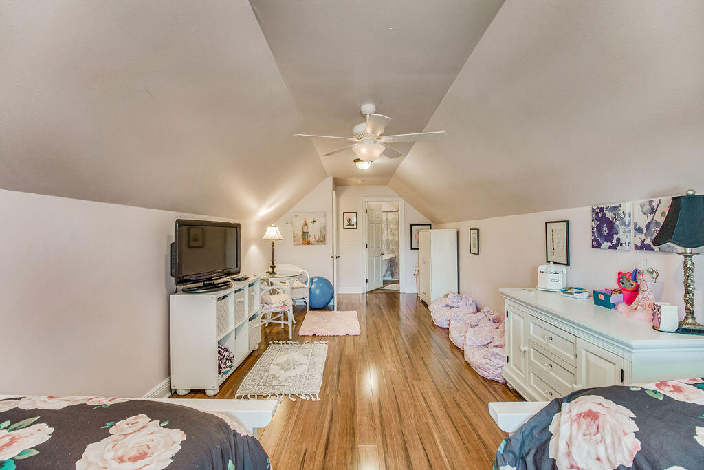 2655 Masters Boulevard Navarre, FL 32566 - Photo 47 of 87 a bedroom with furniture and a flat screen tv