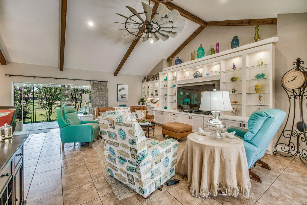 2655 Masters Boulevard Navarre, FL 32566 - Photo 6 of 87 a living room with furniture ceiling fan and a large window