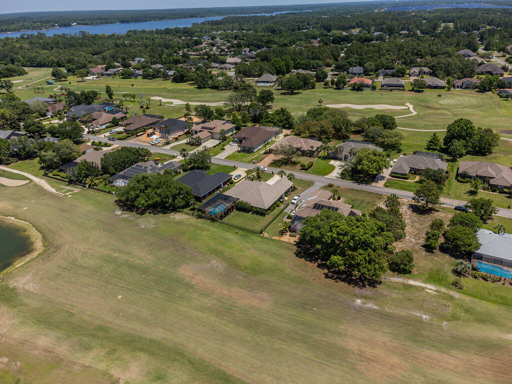 2655 Masters Boulevard Navarre, FL 32566 - Photo 67 of 87 an aerial view of a houses with outdoor space and street view